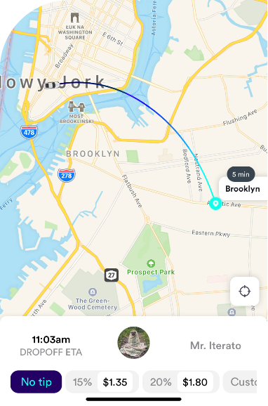 A ride-sharing or delivery app screen showing a map of Brooklyn, New York with a blue route line for a trip in progress. The bottom section displays the estimated drop-off time (11:03am), driver profile picture and name (Mr. Iterato), and tip options ranging from "No tip" to custom dollar amounts.
