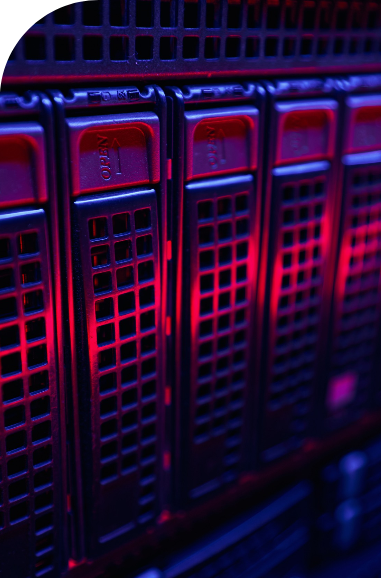 Close-up view of a computer server rack, this time illuminated by vibrant red lighting, highlighting the texture and details of the drive bays.